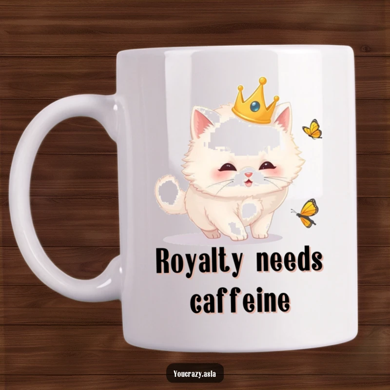 Funny cat mug with a fluffy white cat wearing a golden crown, playfully chasing a butterfly with intense curiosity and regal charm.